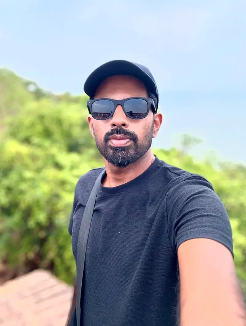 Tijo outdoors in sunglasses