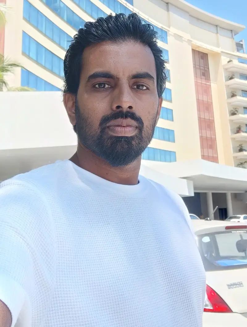 Tijo in a white shirt outdoors